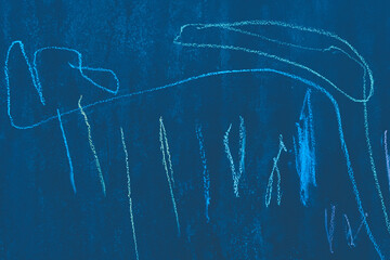 Chaotic abstract drawing pattern crayon blue surface school dirty chalkboard close-up