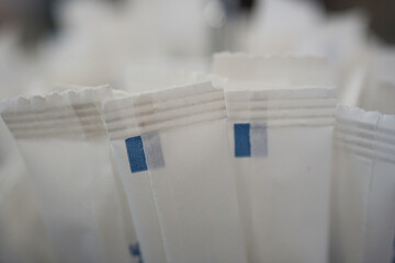 Disposable paper packets containing sugar and salt