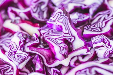 Fresh red cabbage cut into pieces - obrazy, fototapety, plakaty