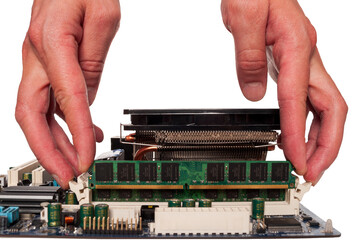 Hand holding RAM modules to assemble a computer, choosing the right components for a computer,...