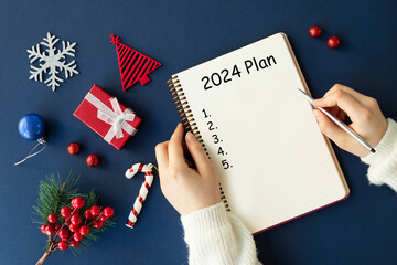 Note book with 2024 goals text on it to apply new year resolutions and plan.