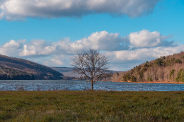 Quaker lake NY, mountain valley landscape late fall weather, sunny windy day