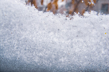 window covered with snow, fallen snow in winter, precipitation