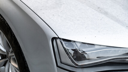 Details of dirty car before washing luxury silver car on touchless car wash. Cleaning the details of car. Cleanliness environment