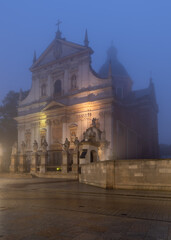 Krakow, Poland, old town with St Peter and Paul church in the fog.