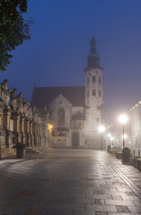 Fototapeta na wymiar Krakow old town, St Andrew church on Grodzka street in the foggy night.