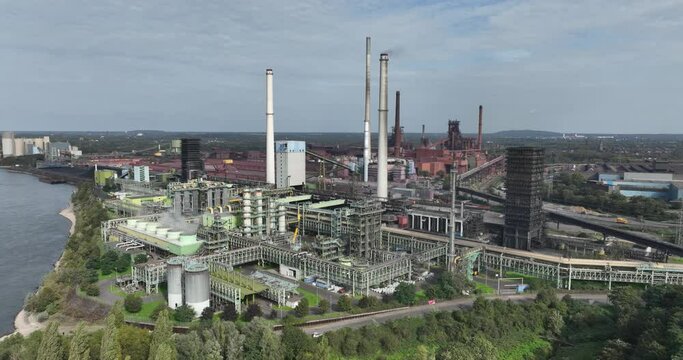 Aerial drone view of The Schwelgern coking plant in Duisburg is one of the largest coking plants in the world. Smokestacks, manufacturing site in hte metal industry.
