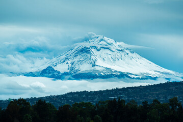 Mexican volcano Popocatepetl with snow since mexico city near of Xochimilco