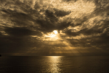 Naklejka na ściany i meble Cloudy dawn next to the Aguilas lighthouse on the Spanish coast.