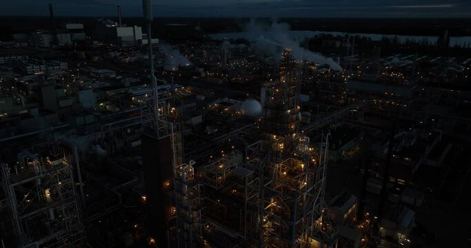 aerial drone view of a polymere production facility in Dordrecht, The Netherlands at night. Close up view of the installation
