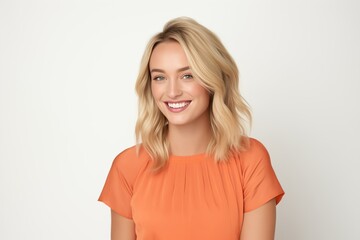 Obraz premium Pretty Fictional Blonde Female Model with Blue Eyes Smiling Candidly. Casual Clothes. Isolated on a Plain White Background. Generative AI.