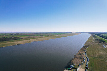 Aerial view drone of river goes into the sea. Delta of Vistula river goes in Baltic Sea in...