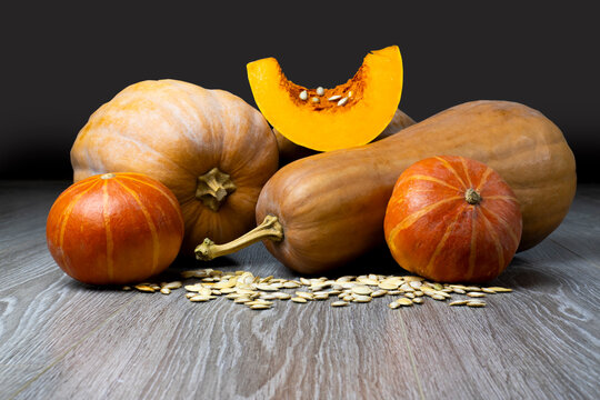 Image of pumpkin on a wooden surface providing space for products or descriptions.
Thanksgiving day or autumn pumpkin holiday.