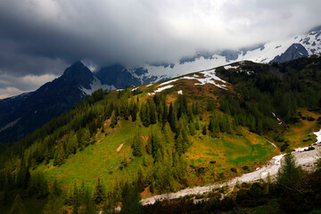 Fototapeta na wymiar The Dachstein mountain range under stormy clouds, Upper-Austria, Europe