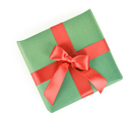 Green Christmas gift box with red ribbon on white background