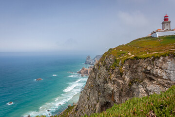 Fototapeta na wymiar Cabo da Roca - cape and lighthouse, westernmost point of the Sintra Mountain Range and continental Europe, Portugal