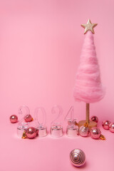 Isolated bright pink background fluffy creative Christmas tree made of wool, transparent numbers...