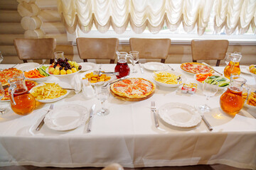 A table served for a children's party with children's favorite fast food. 