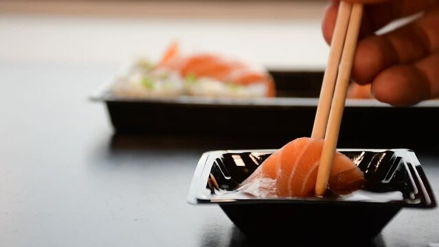 eating sashimi sushi raw salmon fish 