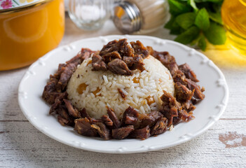 Traditional Turkish food; Roasted meat on rice (Turkish name; pilav üstü kavurma, kurban kavurma, nohutlu etli pilav) Rice pilaf with meat and chickpeas.