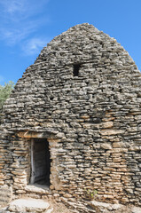 Fototapeta na wymiar One of the dry stone hut in Village des Bories open air museum near Gordes village in Provence region of France