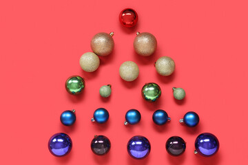 Christmas tree made of balls on red background. LGBT concept