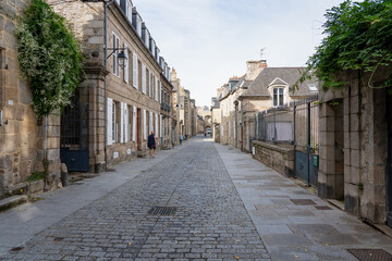 a cobbled street in a French town, beautiful architecture
