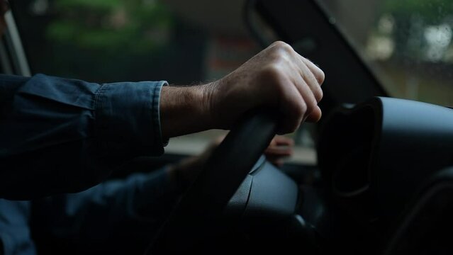 Person hands driving car holding steering wheel. Senior Man driver. Slow motion 120fps commuting on road