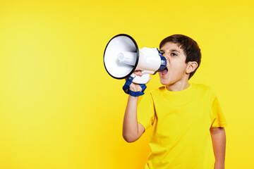 Vibrant shot of an animated boy in yellow tee yelling into a white megaphone against a sunny yellow...