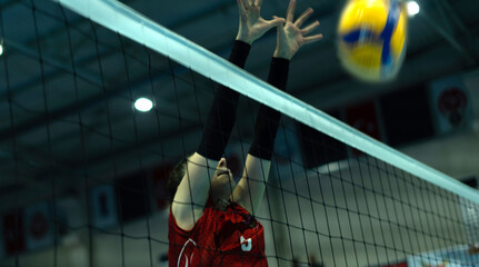 young woman volleyball player at match