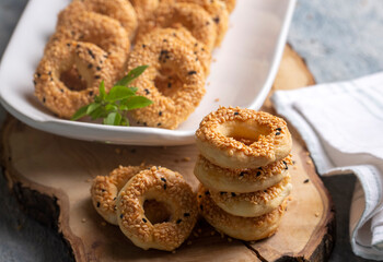 Turkish Bagel with sesame seeds or salty ring cookies. Turkish name; Kandil simidi or tuzlu halka kurabiye - obrazy, fototapety, plakaty