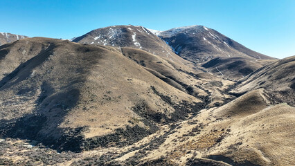Drone perspective photo of the extreme terrain of the Lindis Pass alpine mountain pass