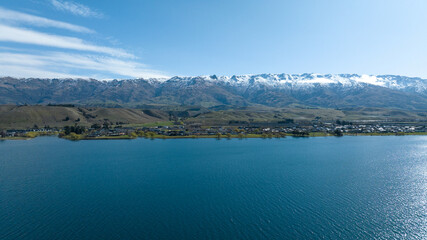 Panoramic aerial drone views of Lake Dunstan and its mountainous shoreline in central Otago