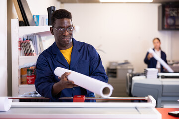 Positive typography technician offering plotter paper roll