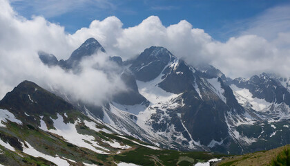 landscape with clouds and snowy peaks of the high tatras