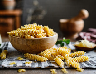 Uncooked fusilli pasta. Uncooked italian pasta on kitchen table.