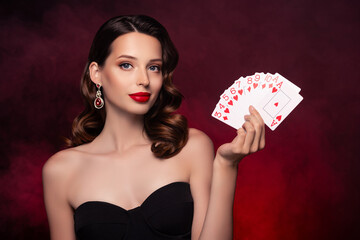 Photo of chic classy lady bluff in poker game for winning rich wealth money over mist dark...