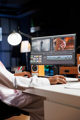 Detailed image of a creative male individual editing a movie on his desktop computer. Selective...