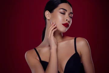 Fotobehang Photo of lovely asian young girl femme fatale closed eyes touch neck shoulders off isolated dark red color background © Beauty Hero