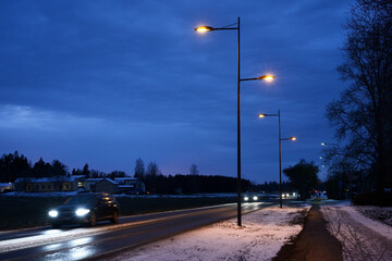 night traffic of cars on the road in a small Finnish town