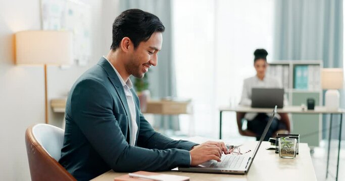 Man at desk, laptop and typing online in coworking space, market research and schedule at consulting agency. Office, admin and happy businessman at computer writing email review, feedback or report.