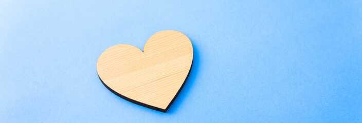 wooden heart on the blue background