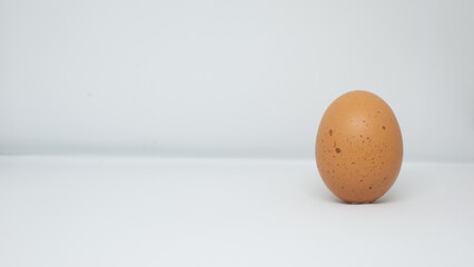 brown eggs on black and white background