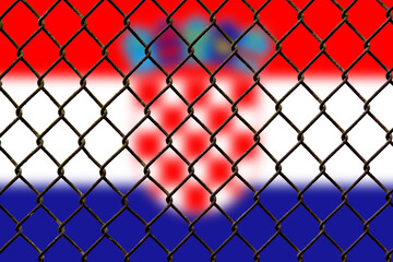 Fototapeta premium A steel mesh against the background of the flag Croatia.
