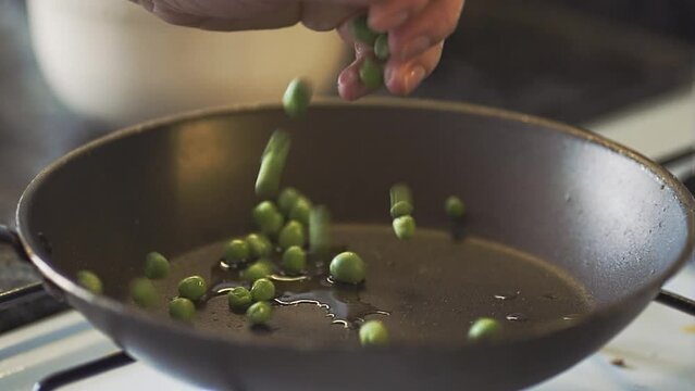 Sequence of a female chef preparing and cooking macaroni pasta with peas, garlic and parmesan cheese