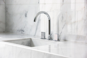 Steel faucet with knobs at kitchen sink