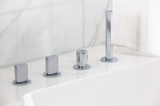 Steel faucet with knobs at kitchen sink