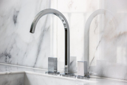 Steel faucet with knobs at kitchen sink