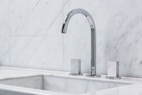 Steel faucet with knobs at kitchen sink
