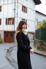 Young brunette with blonde highlights, rural backdrop